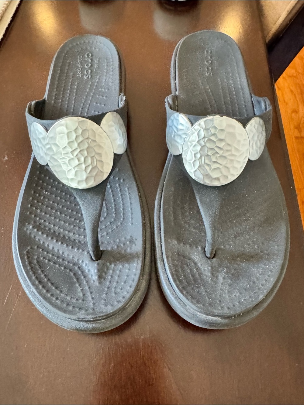 Crocs Women’s Black with Silver Medallion